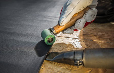 Modern Roof Cover EPDM Rubber Installation Using Air Blower. Roofing Technologies.