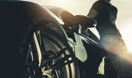 Successful Man and His New Exotic Car Purchase. The Man Toys Theme. Automotive Industry.の写真素材