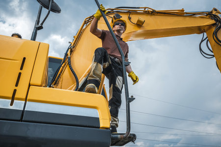 Earth Digger Machine and His Owner. Excavator Job Theme.の写真素材