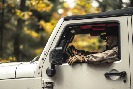 Camouflage Wearing Caucasian Hunter In His Sport Utility Vehicle. Hunting Season Theme.