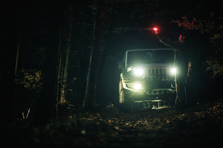 SUV 4x4 AWD Sport Utility Vehicle on Muddy Woodland Road During Night Hours. Expedition Theme.