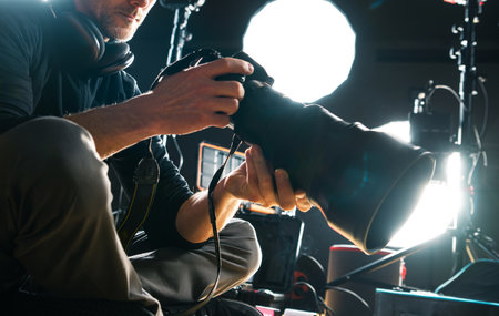 Caucasian Photographer with Modern Camera and Telephoto Lens Attachedの写真素材