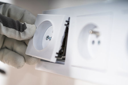 European System Power Outlets Installation Close Up. Electrician at Work.の写真素材
