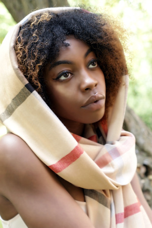 Young Black Woman Autumn Sunshine in the Parkの写真素材