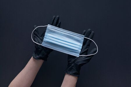 Coronavirus prevention face mask. Social distance, self-isolation during quarantine Covid-19. Safety breathing mask layout, top view, flat lay.の写真素材