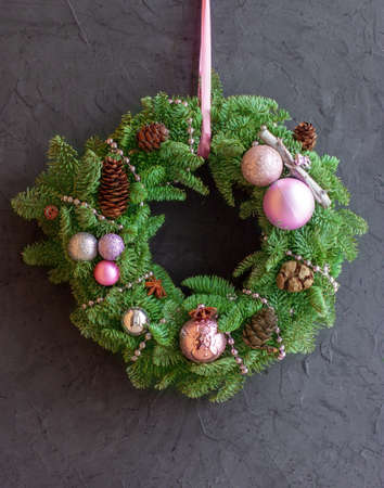 Christmas wreath made of branches of Dutch blue spruce, balls.の写真素材
