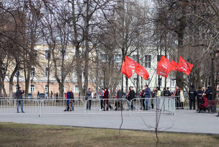 Perm, Russia-April 22.2019. March of Communists with red flags of the political party of the Communist Party in honor of Lenins birthday in the theater square.のeditorial素材