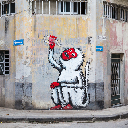 Motif on Calle Manrique in Centro Havana of a monkey downing a bottle (presumably rum given how much the Cuban's love the drink).のeditorial素材