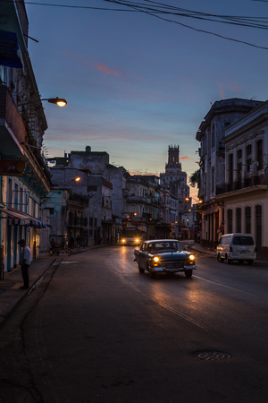 The darkness begins to lift as the sun rises above the rugged streets of Centro Havana one morning - Cuba.This was captured on one of my daily walks at dawn on the streets of Havana as I took in the sights, smells & sounds of the CaribbeanÃ¢ï¿½ï¿½s largesのeditorial素材