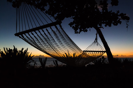 Silhouette of a hammock on Playa Yaguanabo in the south of Cienfuegos.の写真素材