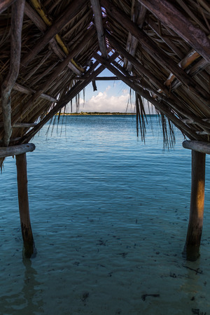 A rustic shelter seen just after sunrise on the coast of Cayo Coco in Cuba.の写真素材