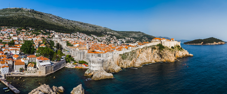Rugged stone walls loop up and around DubrovnikÃ¢ï¿½ï¿½s historic old town.のeditorial素材