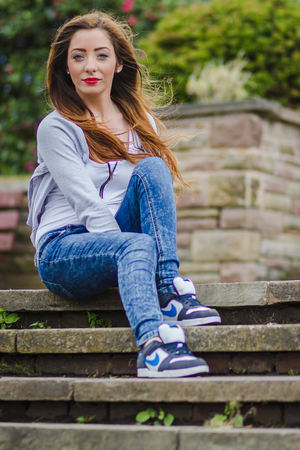 Alex poses on the steps in Marine Gardens, an urban park north of Liverpool.の写真素材