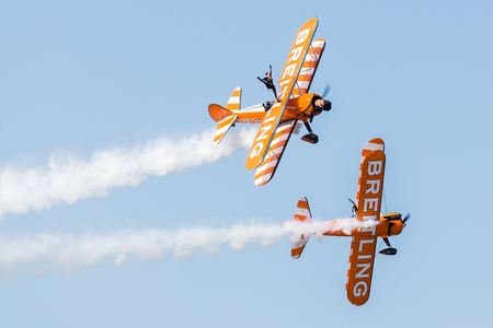 Wingwalkers break away from their formation during the Blackpool airshow in the summer of 2017, a free event held above the beach each year.のeditorial素材