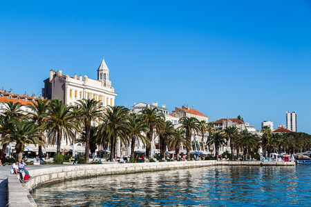 The pretty promenade along the harbour in Split known as the Riva - the trendy strip home to modern cafes greeting tourists who enter the city from boats.のeditorial素材