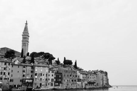 The old town of Rovinj on a hilly peninsula, surrounded by the Adriatic Sea in Croatia.の写真素材