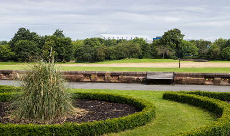 Goodison Park stadium (home of Everton FC) seen in June 2020 in England peeking above the line of trees which surround Stanley Park.のeditorial素材