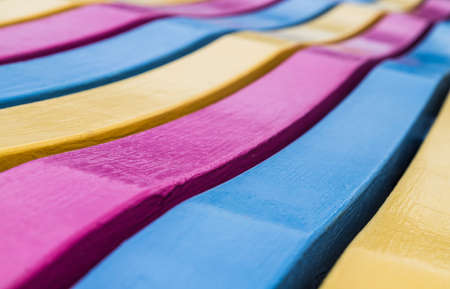 Close up of a wavy bench on the Southport waterfront.の写真素材