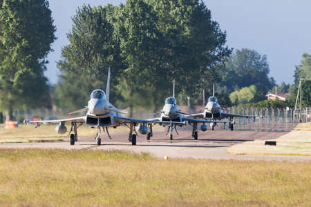 Three Eurofighter Typhoons taxiing out for a training sortie at RAF Coningsby pictured in June 2021.のeditorial素材