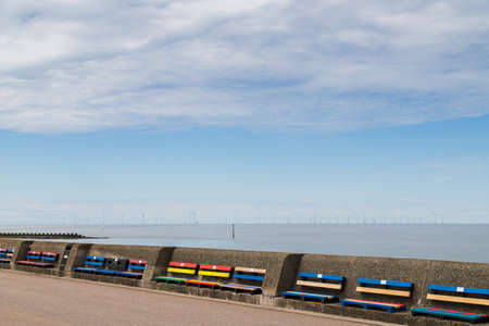 Colourful benches on Wallasey beach promenade seen in July 2020.のeditorial素材