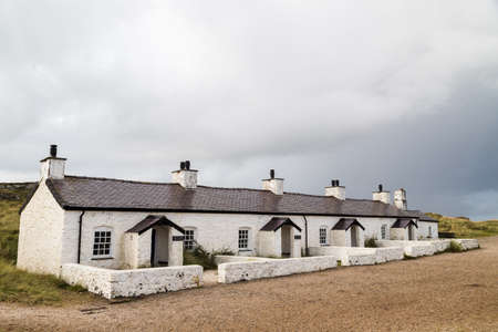 Old pilot cottages on Llanddwyn Island which were once used for pilots to guide boats down the Menai...