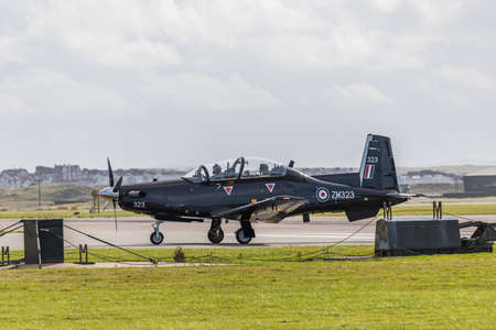 Beechcraft Texan trainer taxiing to the runway at RAF Valley in Wales in October 2021.
