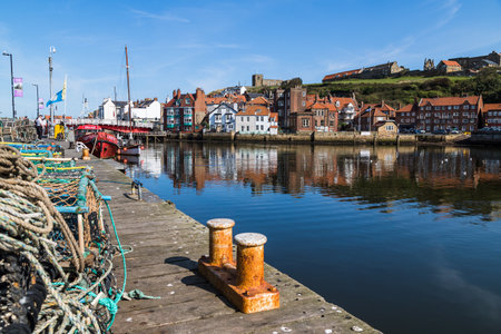 Quayside of Whitby harbour seen under a calm morning in September 2020.のeditorial素材