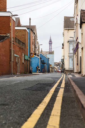 A typical back street seen in September 2021 leading towards Blackpool Tower on the Flyde coast.のeditorial素材