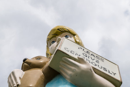 Looking up at the Charity sculpture seen at Yorkshire Sculpture Park near Wakefield seen in June 2021.  This was created by artist Damien Hirst in 2002.のeditorial素材