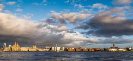 Looking over the River Mersey at the world famous waterfront of Liverpool captured from Woodside on the Wirral in December 2020.のeditorial素材