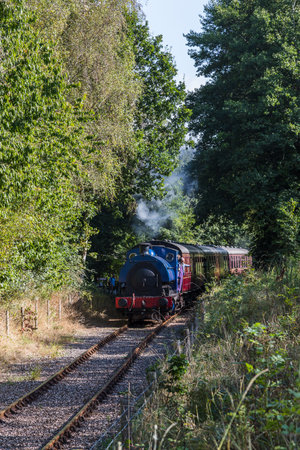 A small steam train seen pulling passengers on the Ribble Steam Railway at Preston in September 2021.のeditorial素材