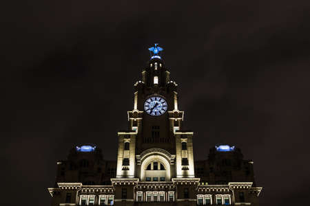 The Royal Liver Building in Liverpool lit up at night in December 2020.のeditorial素材