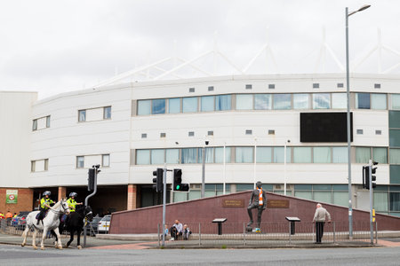 Police on horseback outside Bloomfield Road stadium on a matchday in September 2021 as Blackpool FC welcomed Barnsley FC.のeditorial素材
