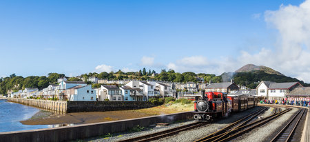 Panorama of a Double Fairlie steam train at Porthmadog preparing to leave the station.  Pictured in North Wales in October 2021.のeditorial素材