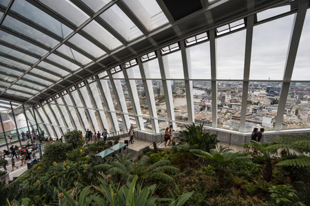 Tourists seen walking up the outside of the Sky Garden onto the very top floor of the Walkie Talkie Building in London seen in August 2022.のeditorial素材