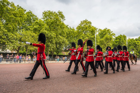 Soldier marching up The Mall towards Buckingham Palace for the Changing of the Guard ceremony in the heart of London seen in August 2022.のeditorial素材