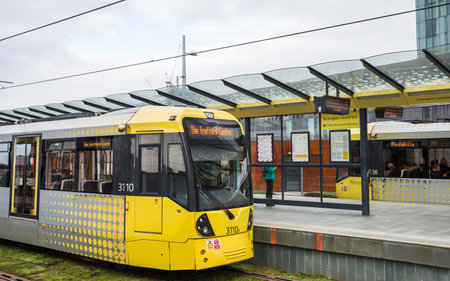 A Metrolink tram pictured in Deansgate Castlefield Station in Manchester in its way to the Trafford Centre in February 2023.のeditorial素材