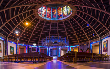 Colourful lights and stunning architectural elements pictured above and around the seating at the Metropolitan Cathedral in Liverpool before Christmas in 2022.のeditorial素材