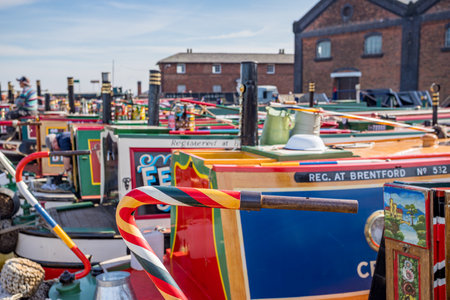 Beautifully painted tiller on the back of a narrow boat Ellesmere Port basin seen during the Easter Boat Gathering in April 2023.のeditorial素材