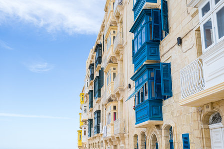 Colourful balconies in Valletta which have recently been restored pictured in April 2022 under a blue sky.の写真素材