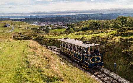 Tourists enjoying a ride on the Great Orme tram going up to the summit at Llandudno on the North Wales coast pictured in October 2021.の写真素材