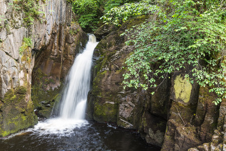 The Hollybush Spout waterfall pictured near Ingleton on the Ingleton Waterfalls Trail in North Yorkshire.の写真素材