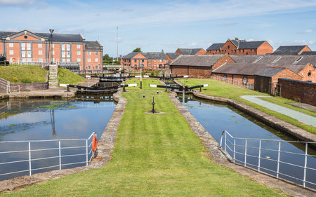 Colourful image of the canal locks at Ellesmere Port, Cheshire seen on a bright day in August 2022.の写真素材