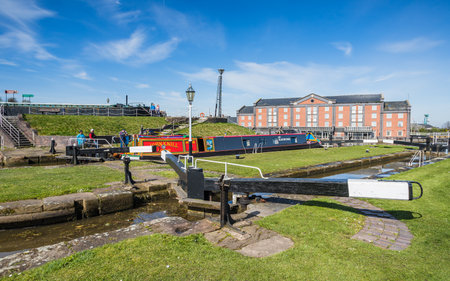 Narrow boats in a lock on the Ellesmere Canal at Ellesmre Port pictured at the Easter Boat Gathering in April 2023.の写真素材