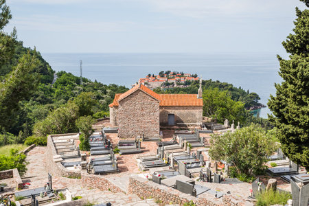 Praskvica Monastery and its cemetry pictured above Sveti Stefan on the Montenegro
 coastline in May 2023.の写真素材