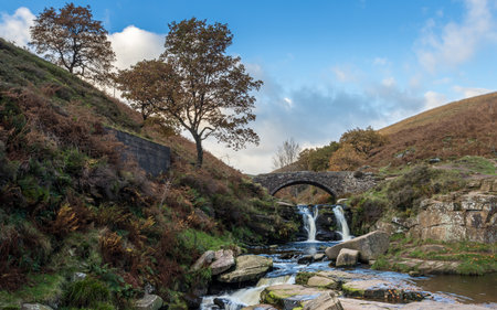 Water flows into a pool at Three Shires Head during the autumn where the counties of Staffordshire, Cheshire and Derbyshire meet.の写真素材