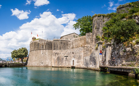 The Gurdic Gate, one of the three entrances into the old town of Kotor pictured under a blue sky in May 2023.の写真素材