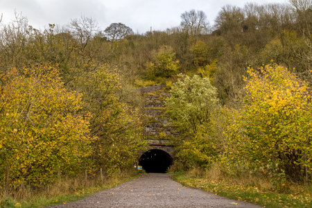 The entrance to Headstone Tunnel which exits onto the Monsal Head viaduct on the Monsal Trail.の写真素材