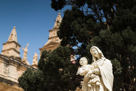 Statue of the Virgin Mary and her baby in front of Our Lady of Mellieha during April 2022 in North Malta.の写真素材