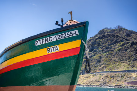 Close up of a Fishing boat at Porto Moniz on the North coast of Madeira Island, Portugal pictured on 1 August 2024 under a blue sky.の写真素材
